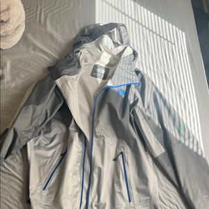 The North Face Gray Rain Jacket with Blue Trim